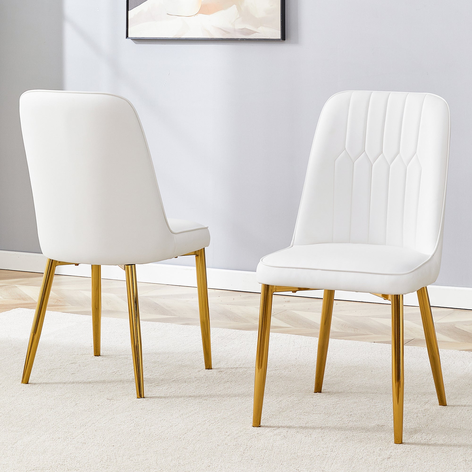 2 Modern Dining Chairs, Sleek Pu Leather Backrest, and Gold Metal Legs Bring a Comfortable Home Experience To The Kitchen, Bedroom, and Office.