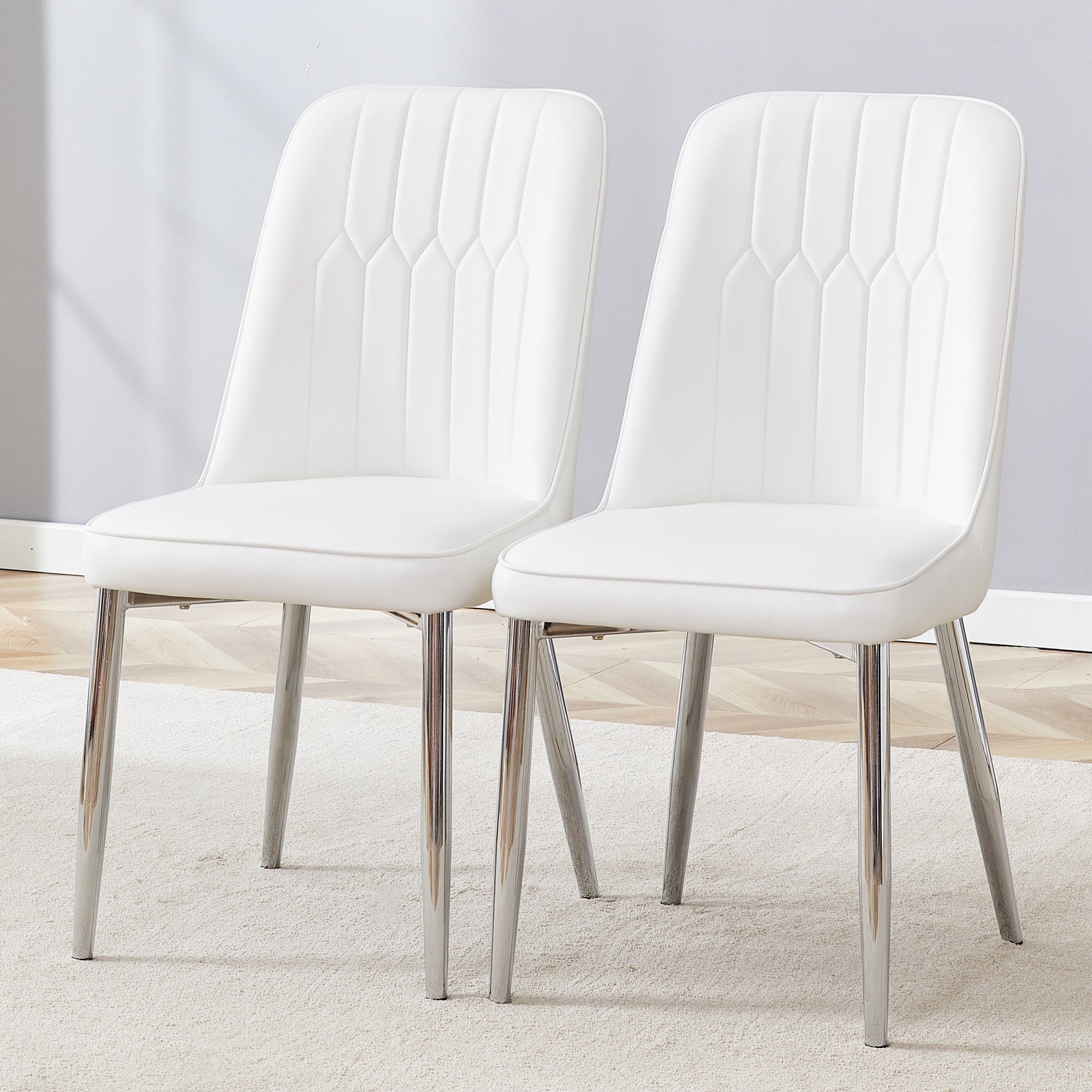 2 Modern Dining Chairs, Smooth Pu Leather Backrest and Silver-Toned Metal Legs for a Comfortable Home Experience for Kitchens, Bedrooms and Offices.