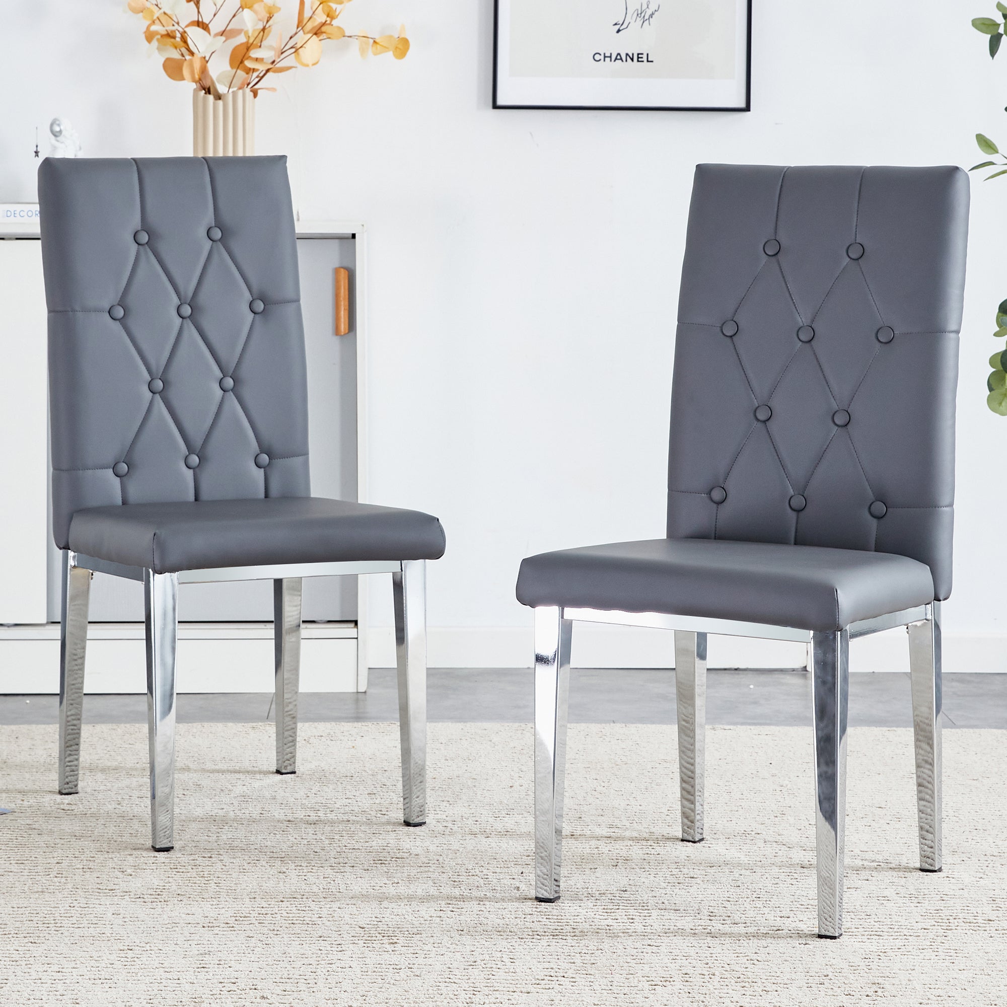 2 Piece Set of Gray Armless Dining Chairs Brings a Touch of Elegance and Mystery To The Dining Area With Its Deep Gray Tone, The Grid and Buckle Design of The Back Add a Vintage Yet Fashionable Touch