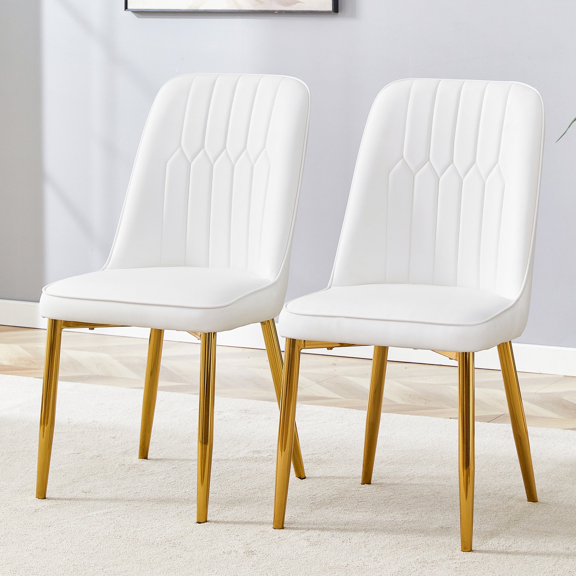 2 Modern Dining Chairs, Sleek Pu Leather Backrest, and Gold Metal Legs Bring a Comfortable Home Experience To The Kitchen, Bedroom, and Office.