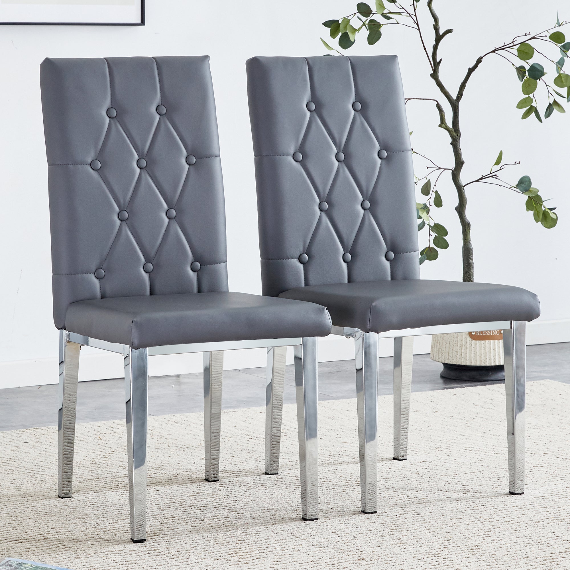 2 Piece Set of Gray Armless Dining Chairs Brings a Touch of Elegance and Mystery To The Dining Area With Its Deep Gray Tone, The Grid and Buckle Design of The Back Add a Vintage Yet Fashionable Touch