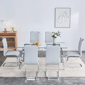 A Modern Minimalist Rectangular Glass Dining Table With Tempered Glass Tabletop And Silver Metal Legs, Suitable For Kitchens, Restaurants, And Living Rooms, 63"*35.4"*30"