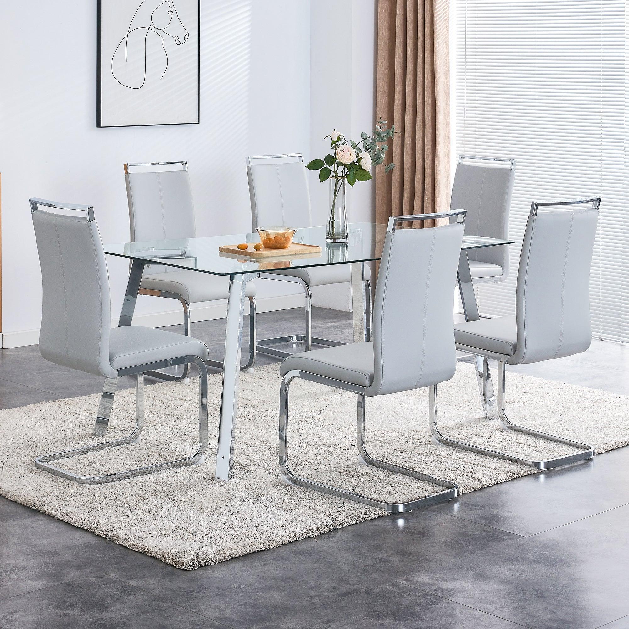 A Modern Minimalist Rectangular Glass Dining Table With Tempered Glass Tabletop And Silver Metal Legs, Suitable For Kitchens, Restaurants, And Living Rooms, 63"*35.4"*30"